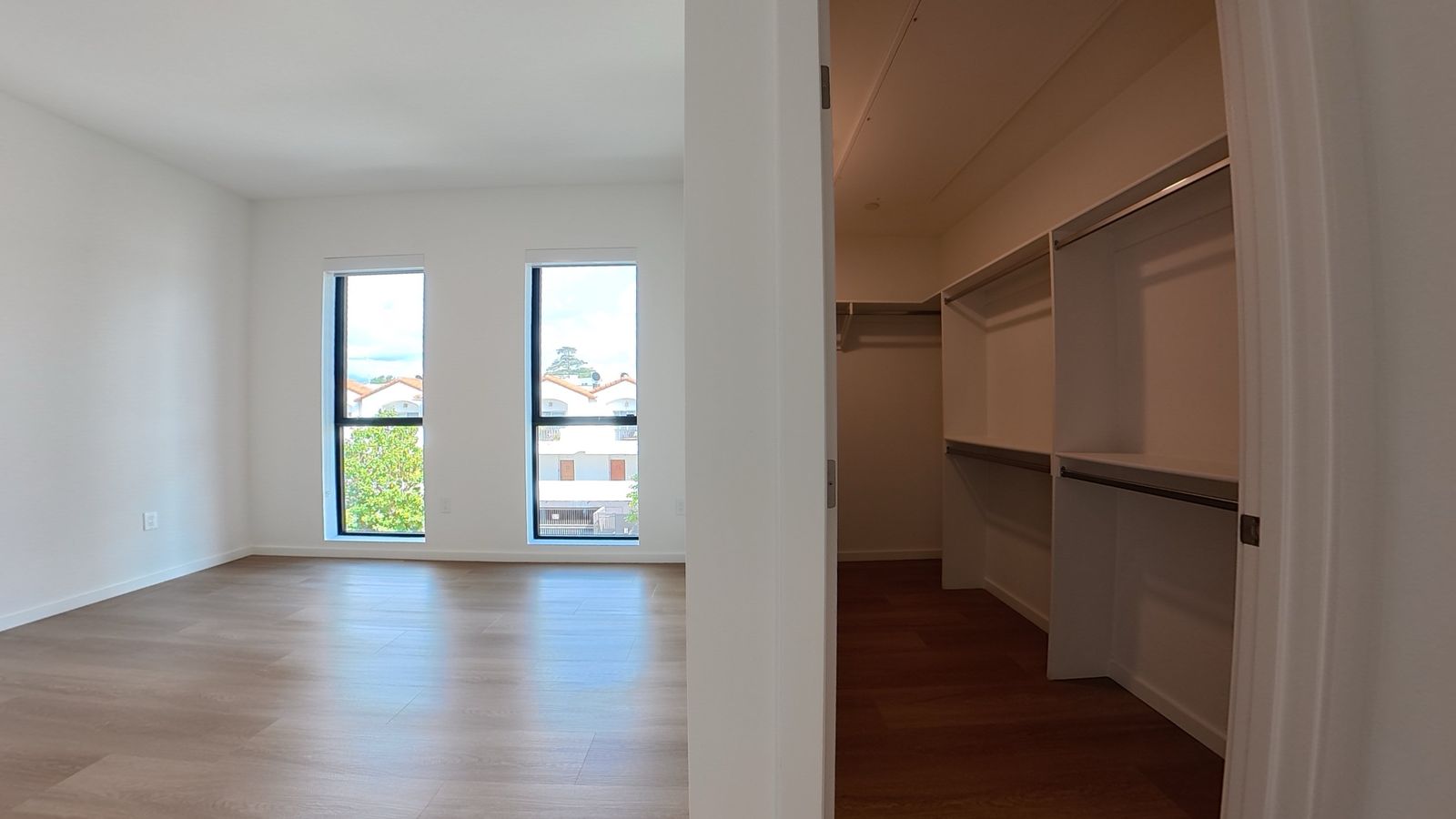 Primary bedroom with custom walk-in closet