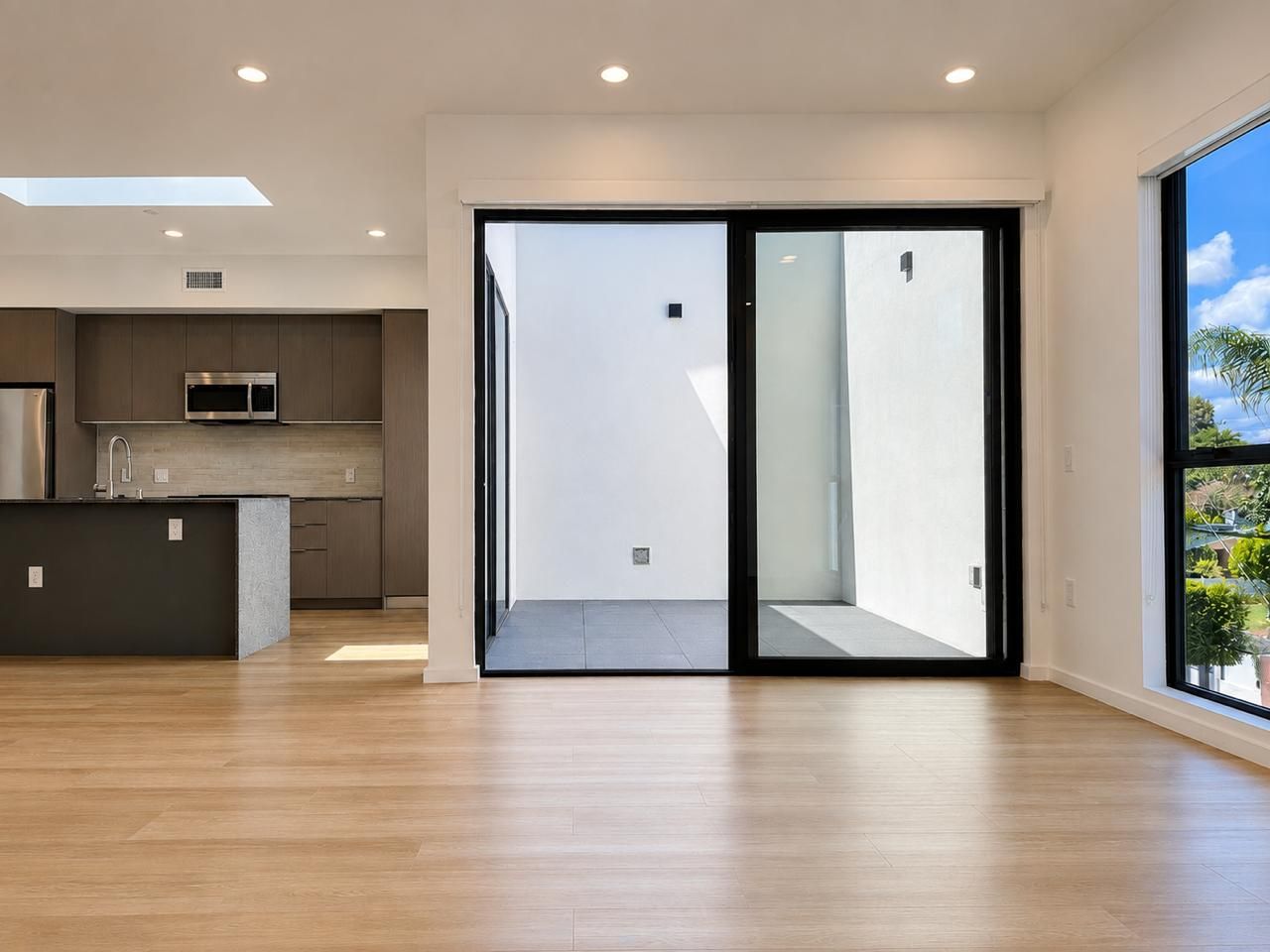 Penthouse living area opening to a private terrace